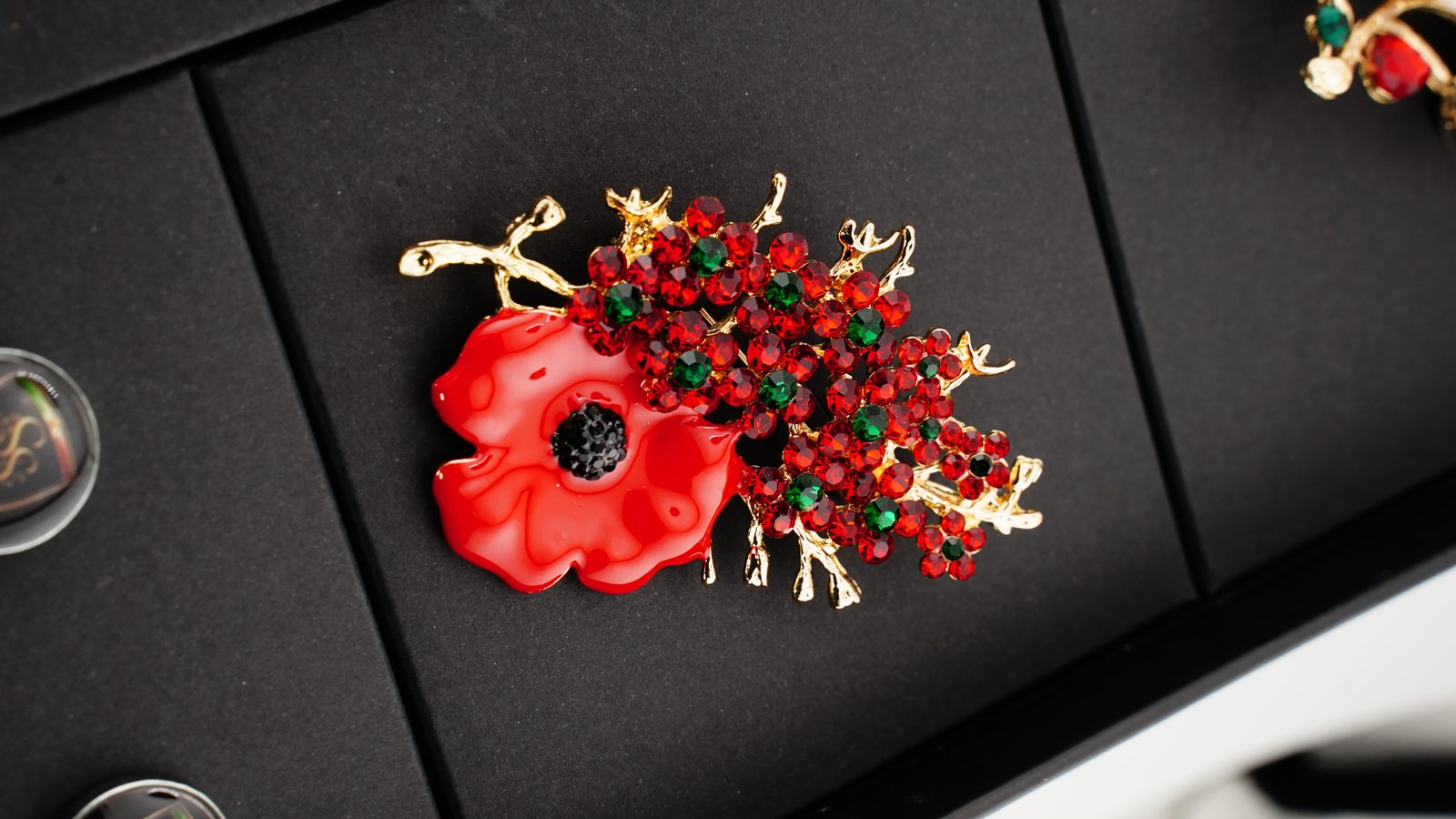 Sam & Sara Prestige Silk Collection — red crystal poppy brooch close-up